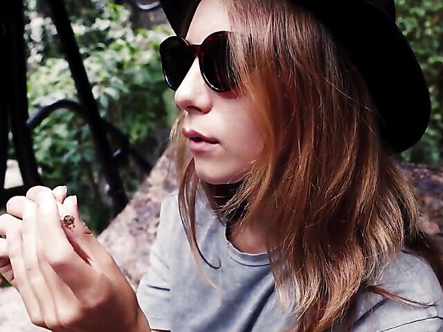 Met Art model with sunglasses Belka stripping and smoking in the garden