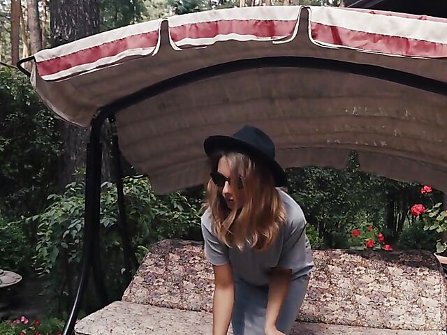 Met Art model with sunglasses Belka stripping and smoking in the garden