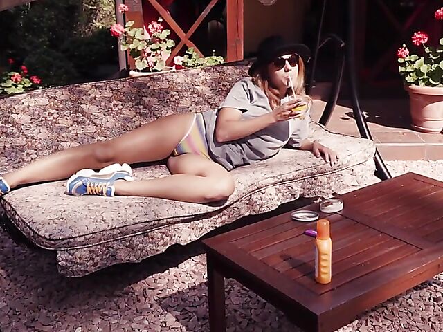 Met Art model with sunglasses Belka stripping and smoking in the garden