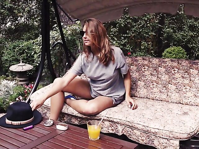 Met Art model with sunglasses Belka stripping and smoking in the garden