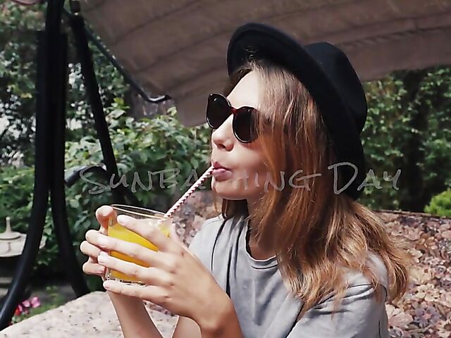 Met Art model with sunglasses Belka stripping and smoking in the garden