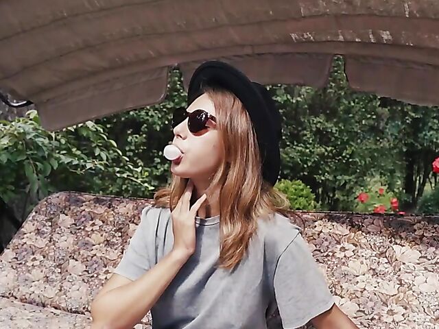 Met Art model with sunglasses Belka stripping and smoking in the garden