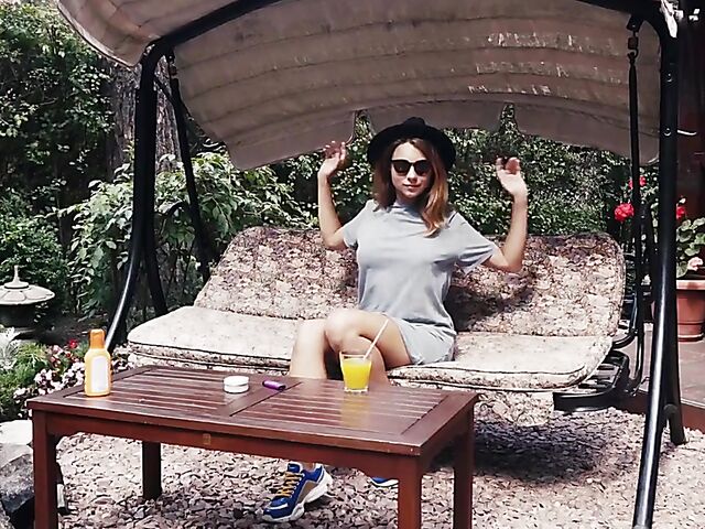 Met Art model with sunglasses Belka stripping and smoking in the garden