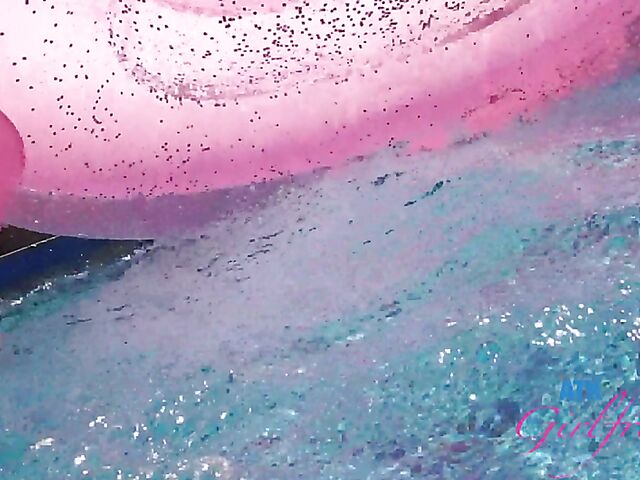 Babyfaced asian Mi Ha Doan swimming naked in the pool