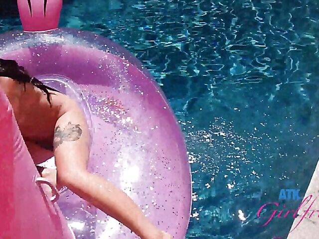 Babyfaced asian Mi Ha Doan swimming naked in the pool