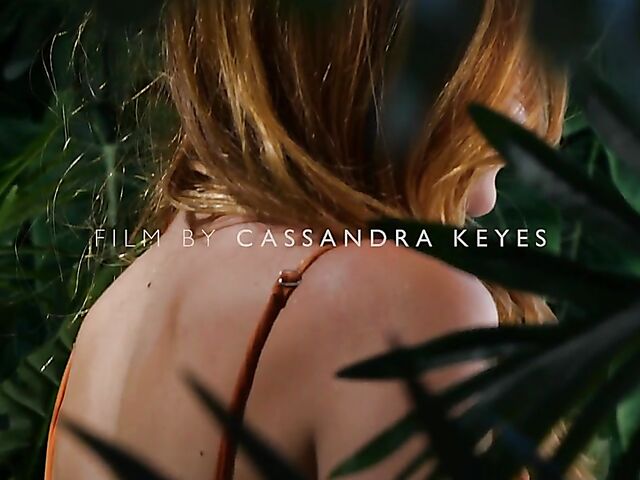 Sexy redhead Celeste Rasmussen takes off her bodysuit and shows her natural bush