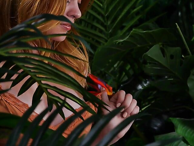 Sexy redhead Celeste Rasmussen takes off her bodysuit and shows her natural bush