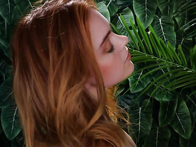 Sexy redhead Celeste Rasmussen takes off her bodysuit and shows her natural bush