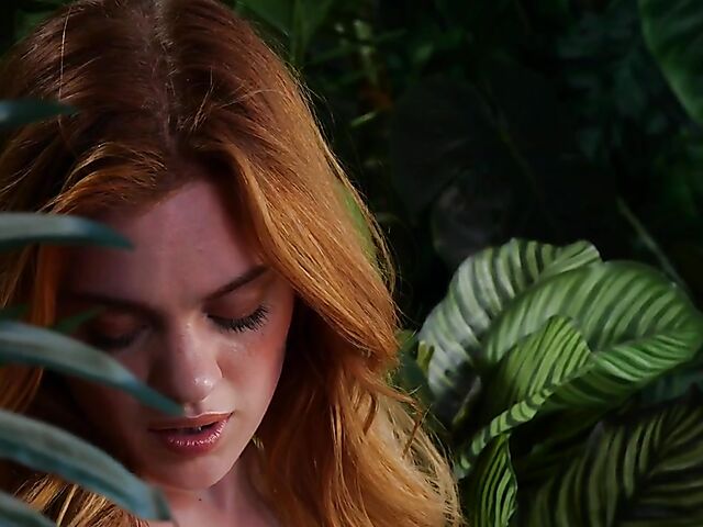 Sexy redhead Celeste Rasmussen takes off her bodysuit and shows her natural bush