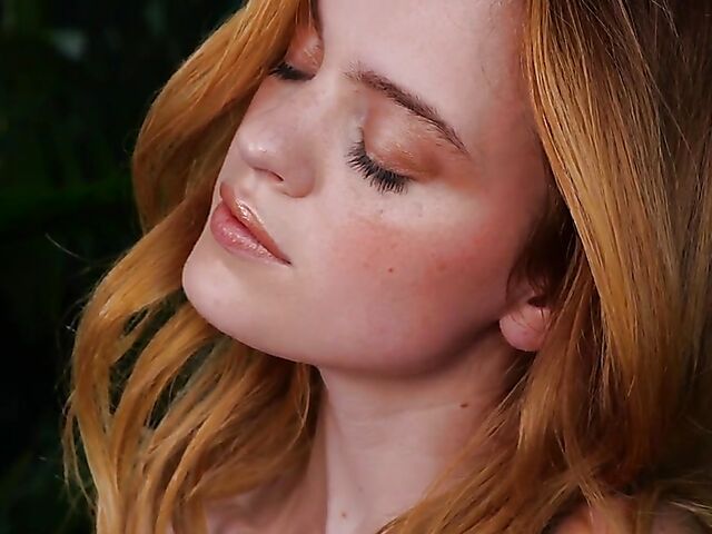 Sexy redhead Celeste Rasmussen takes off her bodysuit and shows her natural bush