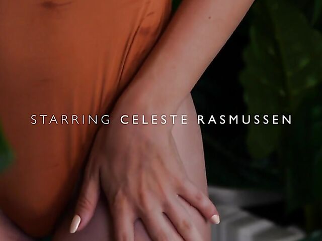 Sexy redhead Celeste Rasmussen takes off her bodysuit and shows her natural bush