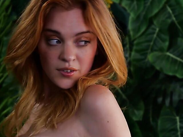 Sexy redhead Celeste Rasmussen takes off her bodysuit and shows her natural bush
