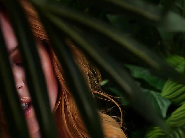 Sexy redhead Celeste Rasmussen takes off her bodysuit and shows her natural bush