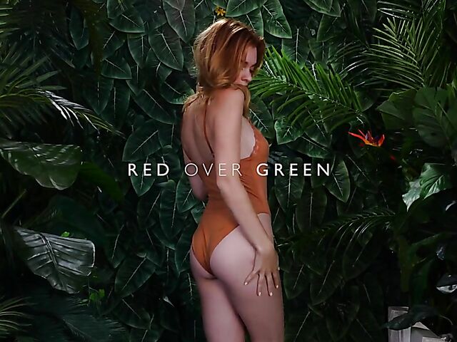 Sexy redhead Celeste Rasmussen takes off her bodysuit and shows her natural bush