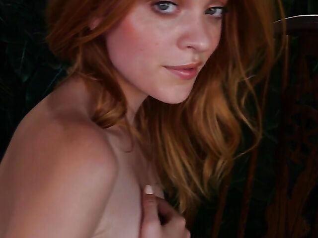 Sexy redhead Celeste Rasmussen takes off her bodysuit and shows her natural bush