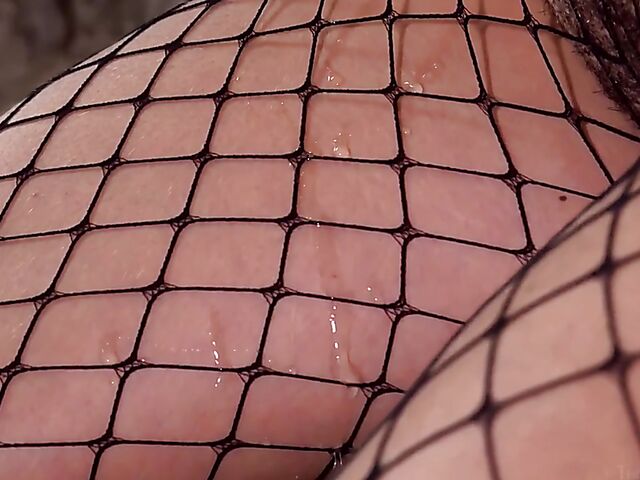 Bondage solo in fishnets with kinky Ursula B fingering herself with her collar on