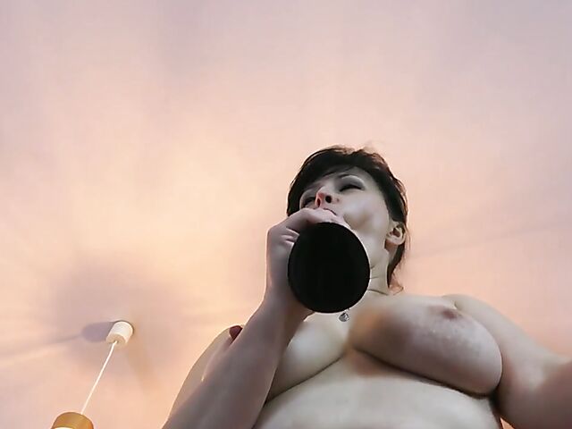 Hairy MILF solo with her dildo in latex and nylons