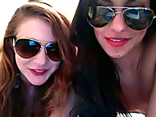 Two hot babes caress each others naked bodies