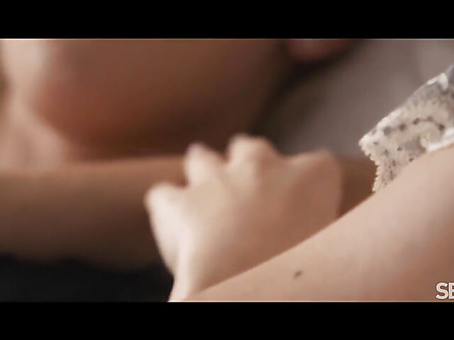 Two hot lesbians Emma Button and Jenny Wild eat and finger each other in bed