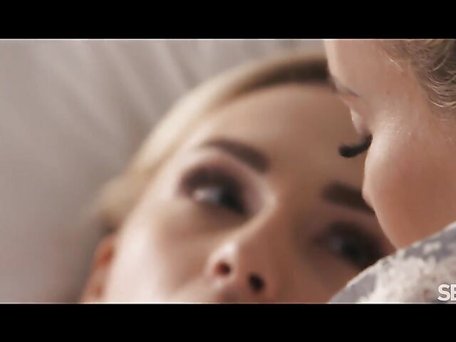 Two hot lesbians Emma Button and Jenny Wild eat and finger each other in bed