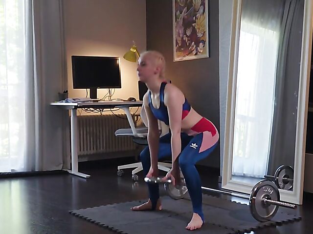 Mia gets her strapless dildo ready to fuck a cute lesbian fitness girl