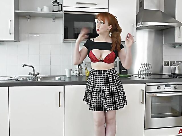 Mature cucumber addict fucks herself in the kitchen