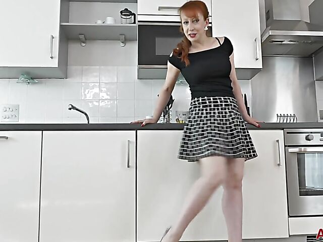 Mature cucumber addict fucks herself in the kitchen