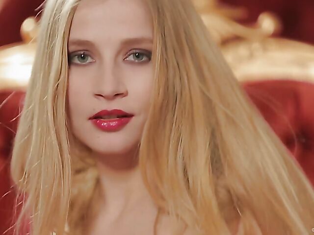 Long haired blonde babe Victoriya displays her shaved snatch and nice natural boobies