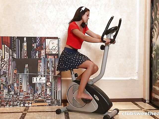 Tarre fingering herself on the exercise bike