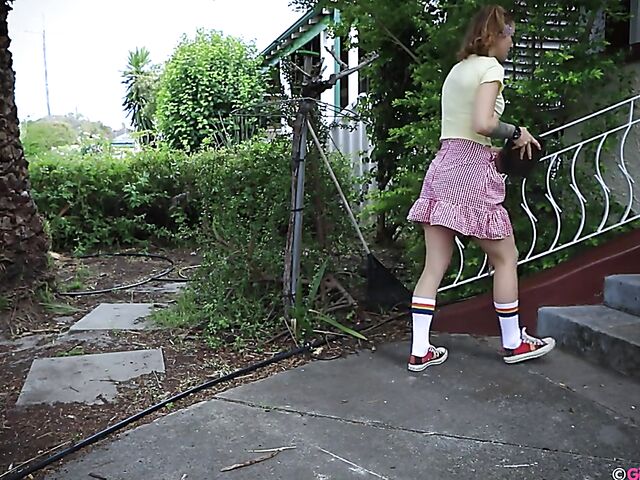 Naughty girl in a mini skirt Pixie Faye picking flowers and fingering herself