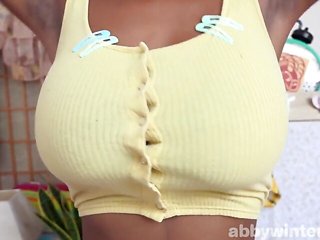 Sporty ebony girl with glasses Selena D displays her big black tits with huge areolas