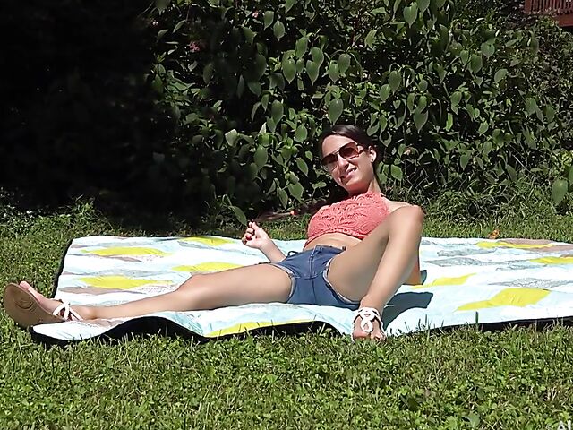 Petite Freya Von Doom's pussy spread in the sun behind the scenes