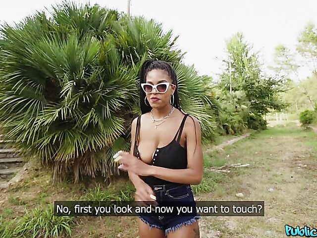 Ebony huge tits girl Tina Fire fucks a white cock outdoors for cash