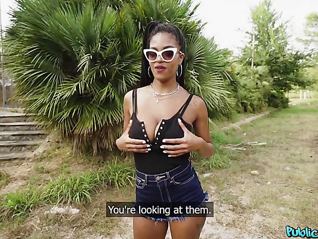 Ebony huge tits girl Tina Fire fucks a white cock outdoors for cash