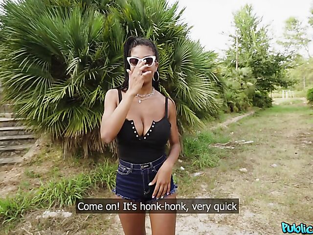 Ebony huge tits girl Tina Fire fucks a white cock outdoors for cash