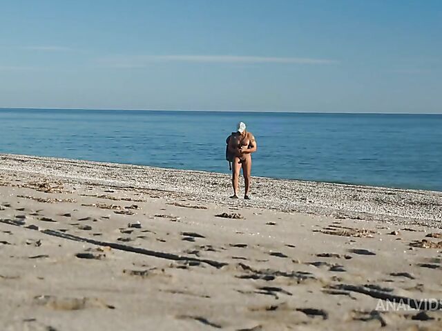 Interracial beach anal threesome with two sexy nudists Paola Hard and Lily Doll