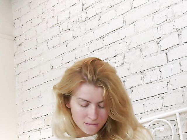 Russian blonde Betty Swan gets nude in her bed to stroke her clit for you