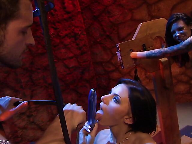 Kinky lesbian brunettes have sex in the dungeon as their male slave jerks off