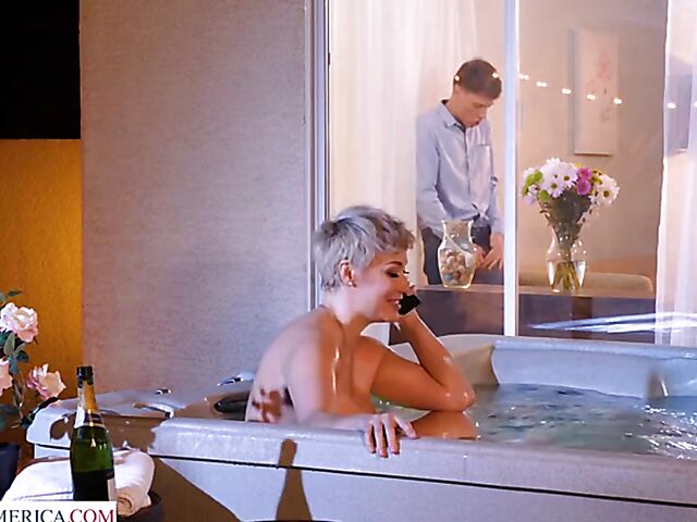 Short hair MILF with big melons Ryan Keely relaxing in a hot tub and fucking a peeping boy