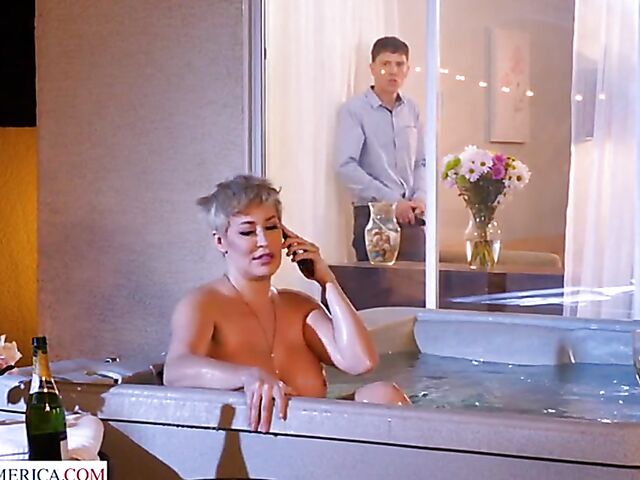 Short hair MILF with big melons Ryan Keely relaxing in a hot tub and fucking a peeping boy