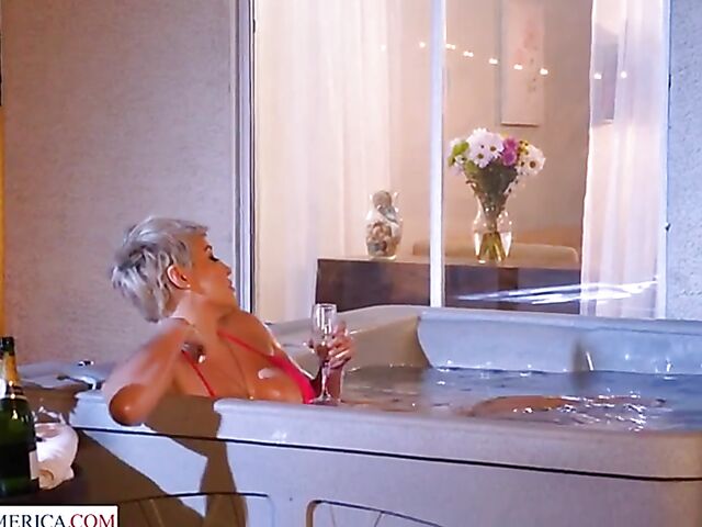 Short hair MILF with big melons Ryan Keely relaxing in a hot tub and fucking a peeping boy