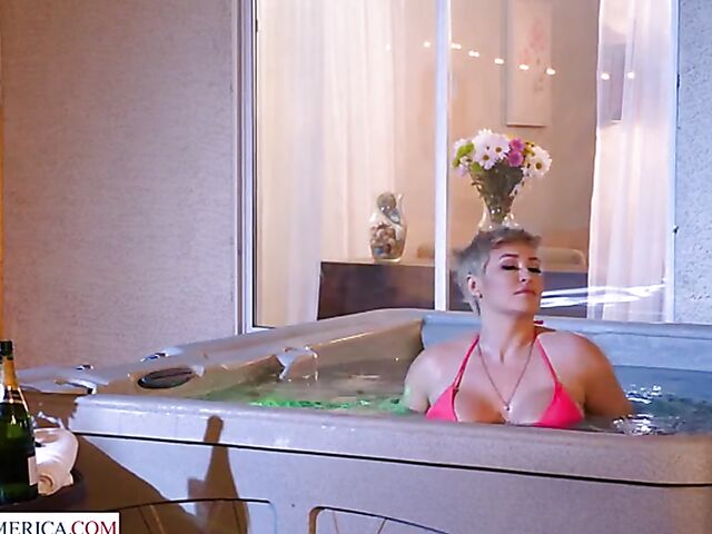 Short hair MILF with big melons Ryan Keely relaxing in a hot tub and fucking a peeping boy