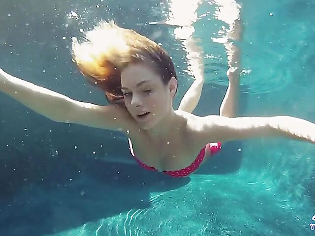Taylor Dare takes off her pink bikini and poses nude underwater