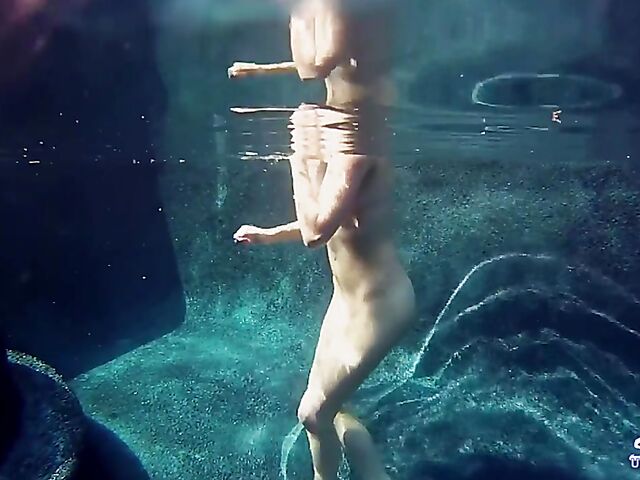 Taylor Dare takes off her pink bikini and poses nude underwater