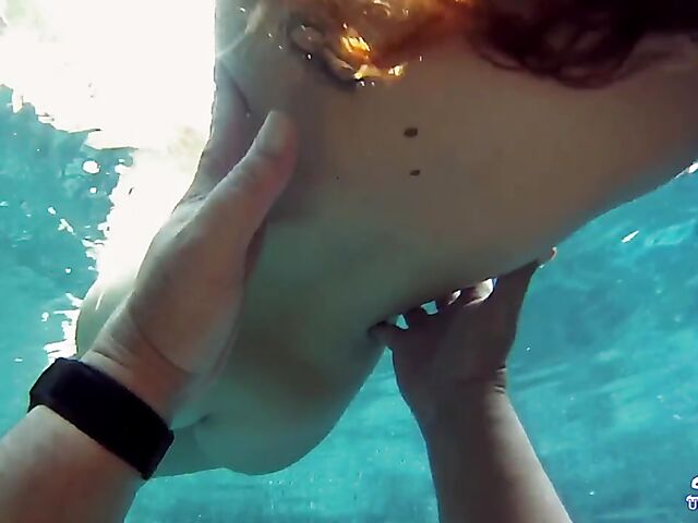 Taylor Dare takes off her pink bikini and poses nude underwater