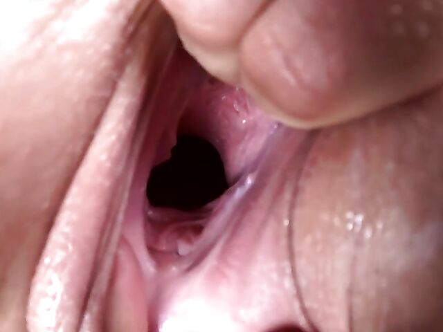 Lady in red Claudia's gaping pussy closeup