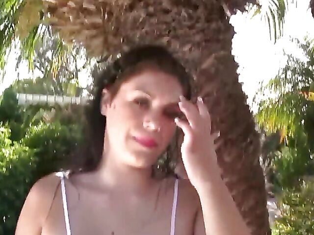 Busty model with big natural tits Satinee Capona gets wet under the palm tree