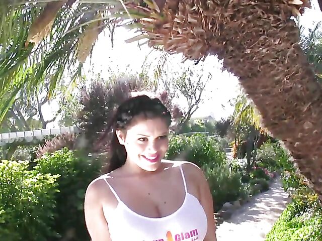 Busty model with big natural tits Satinee Capona gets wet under the palm tree