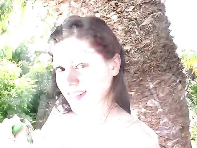 Busty model with big natural tits Satinee Capona gets wet under the palm tree