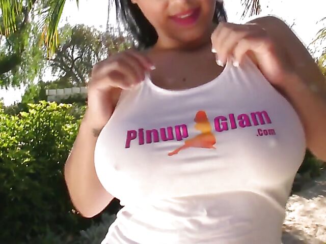 Busty model with big natural tits Satinee Capona gets wet under the palm tree